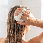 ScalpBloom hero - massaging scalp in shower
